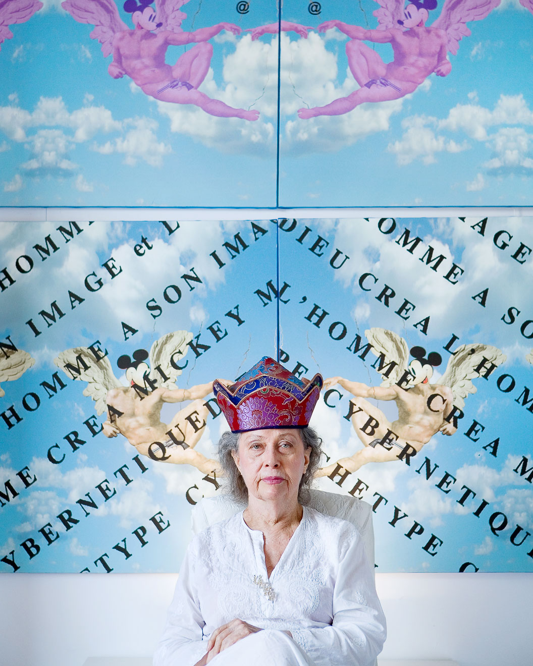 Portrait of Ultra Violet, posing in front of one of her paintings