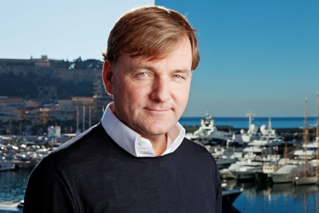 Portrait of Espen Oeino, harbour in the background