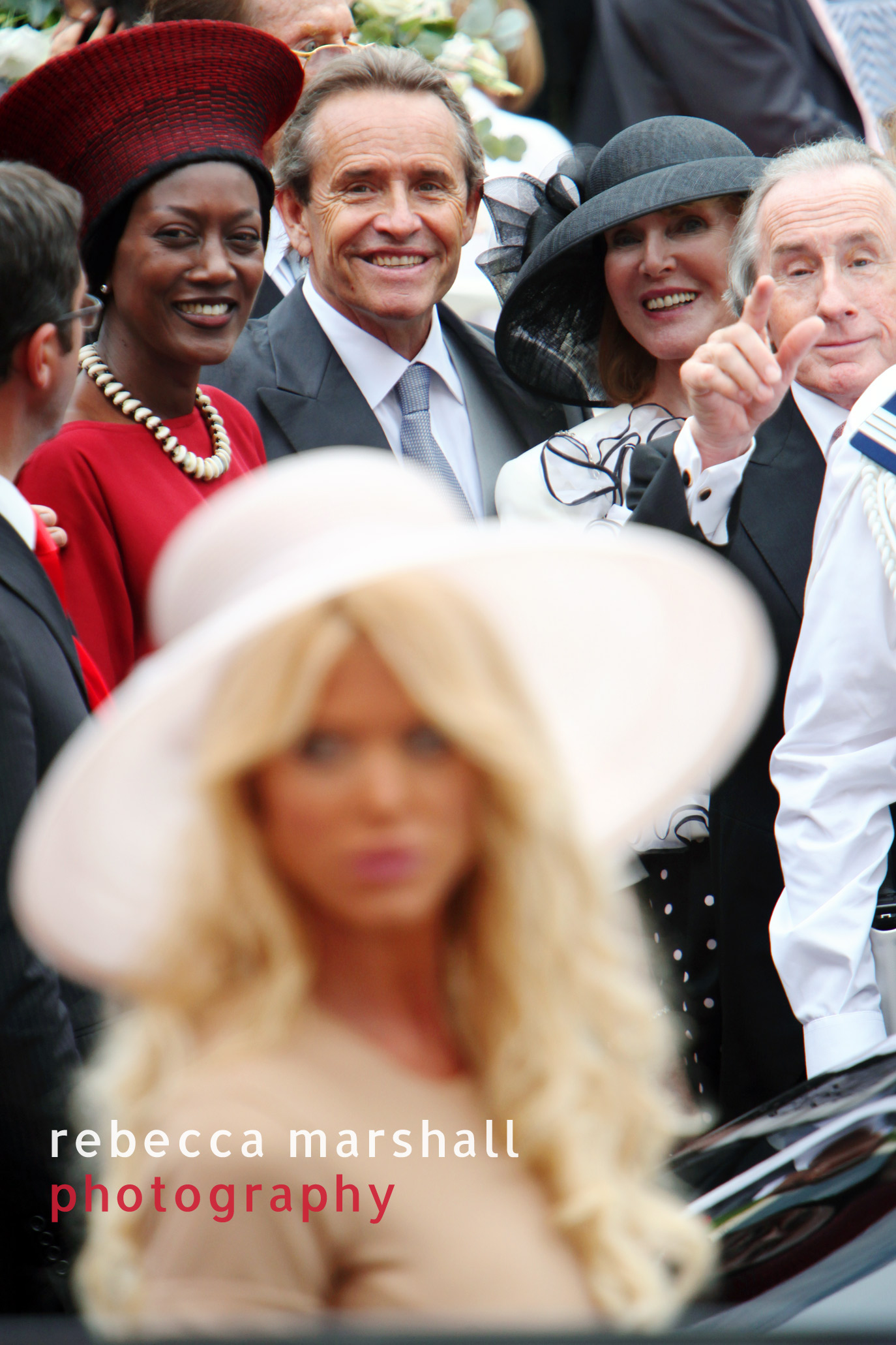 Formula One drivers Jacky Ickx and Jackie Stewart (Victoria Silvstedt in the foreground)