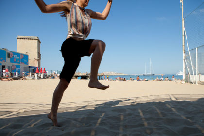Girl jumping on a beach