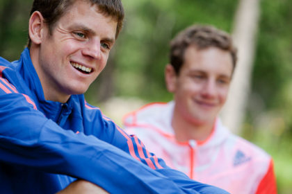 Close-up photograph of Alistair and Jonathan Brownlee in training gear outdoors
