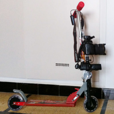 Photograph of child's scooter with camera and flash attached