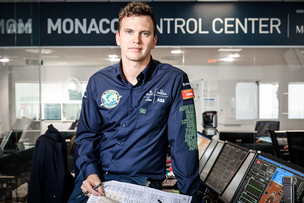 Portrait of engineer leaning on his desk in control room