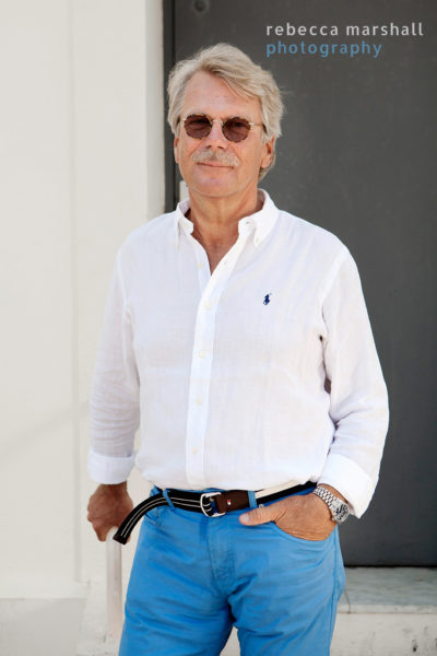 Portrait of Bjorn Wahlroos against a grey doorway
