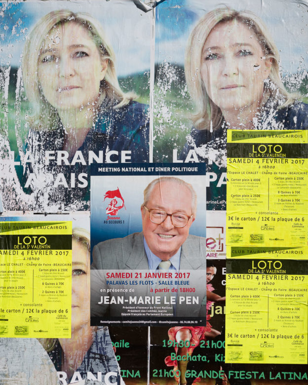 Photo of tatty French National Front posters on a wall