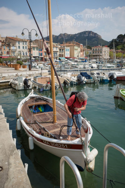 Carlo Rovelli prepares his fishing boat in the harbour of the village of Cassis