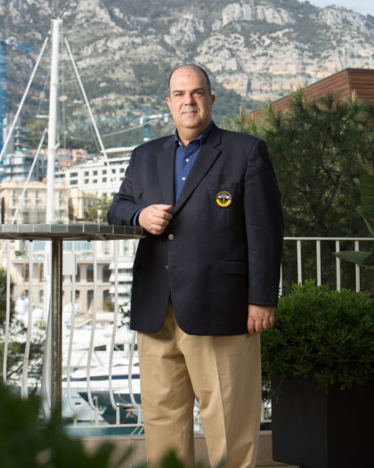 Full length, vertical portrait of Sir Stelios Haji-Ioannou posing outdoors