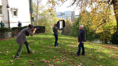 Photograph of portrait photographer Rebecca Marshall at work, in a park