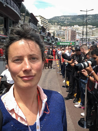 Photograph of woman inside security cordon at Monaco Grand Prix pit lane