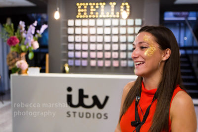 Girl in red welcomes guests to ITV studios reception