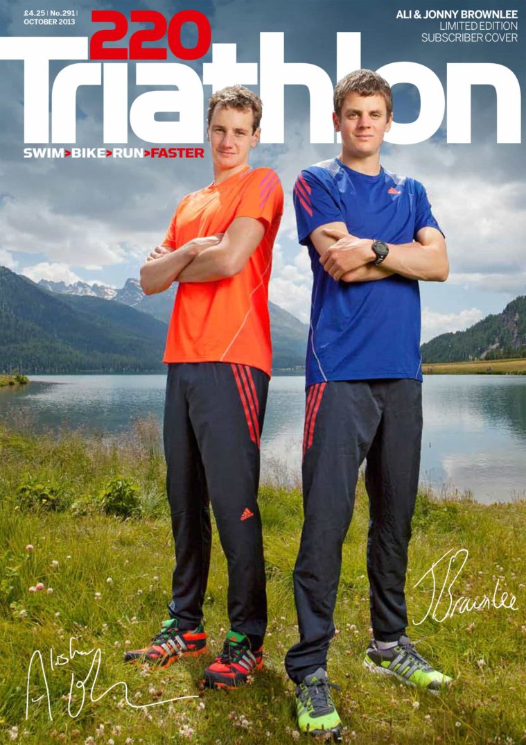 Magazine cover showing 2 athletes standing in running clothes beside a lake