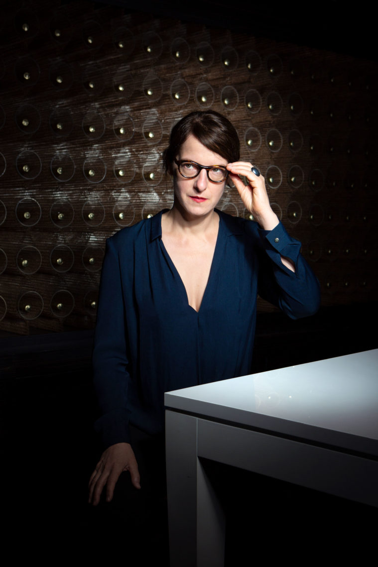 Portrait of a woman in glasses looking off camera
