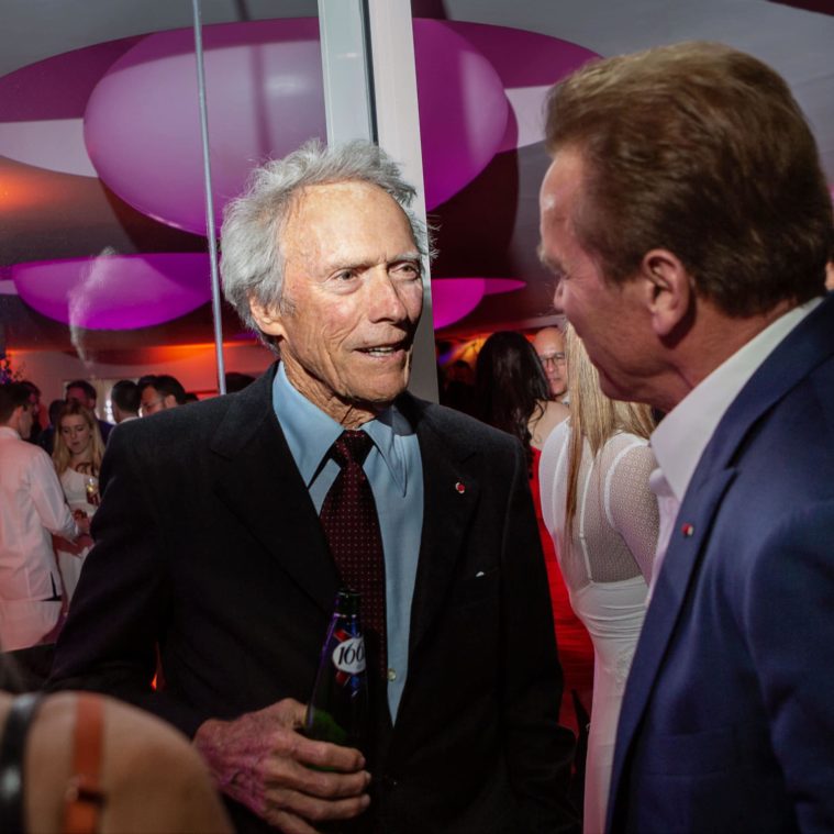 Two men talking at a party