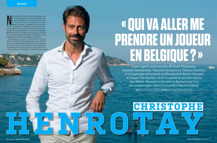 Double page magazine spread showing portrait of a man in white shirt on a terrace by the sea
