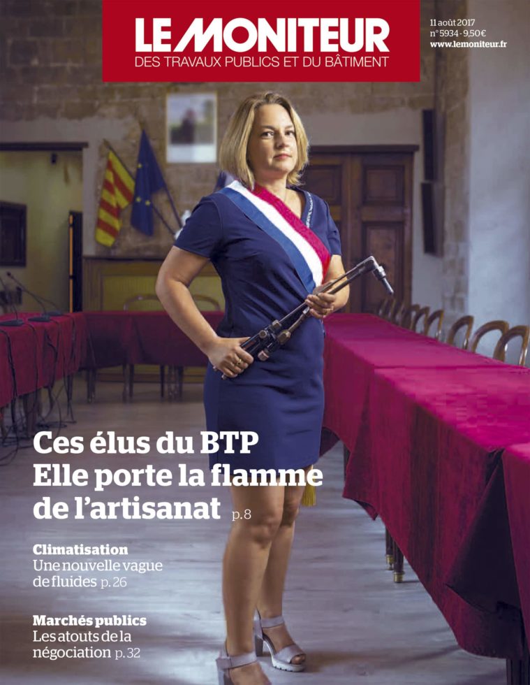 Magazine cover showing a female town hall official wearing a French red, white and blue sash and holding a blowtorch