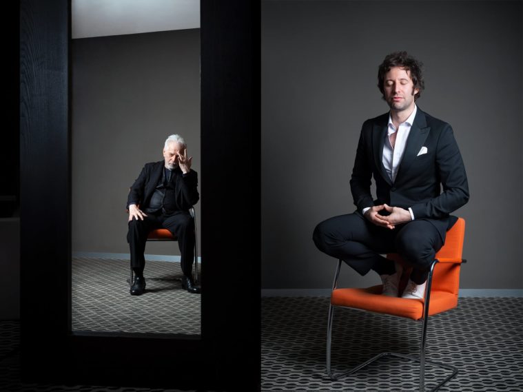Diptych portraits of 2 men, one sitting on an orange chair, the other squatting on the chair, eyes shut