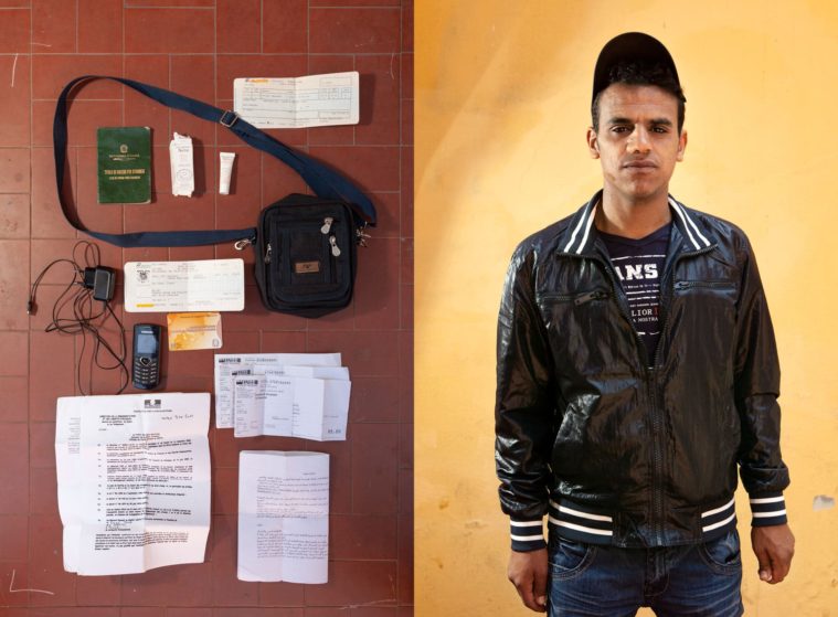 Diptych of two photographs: a portrait of a man standing in front of a yellow wall and a picture of a few personal posessions, papers, phone and a charger, on the ground