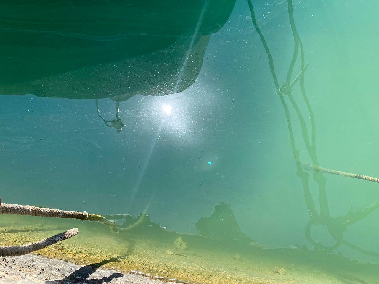 Photograph of blue-green water in a harbour