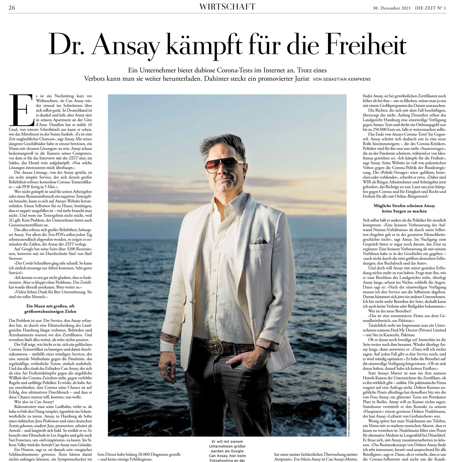 Page from German newspaper Die Zeit showing portrait of a man in a white linen jacket standing in front of the ocean