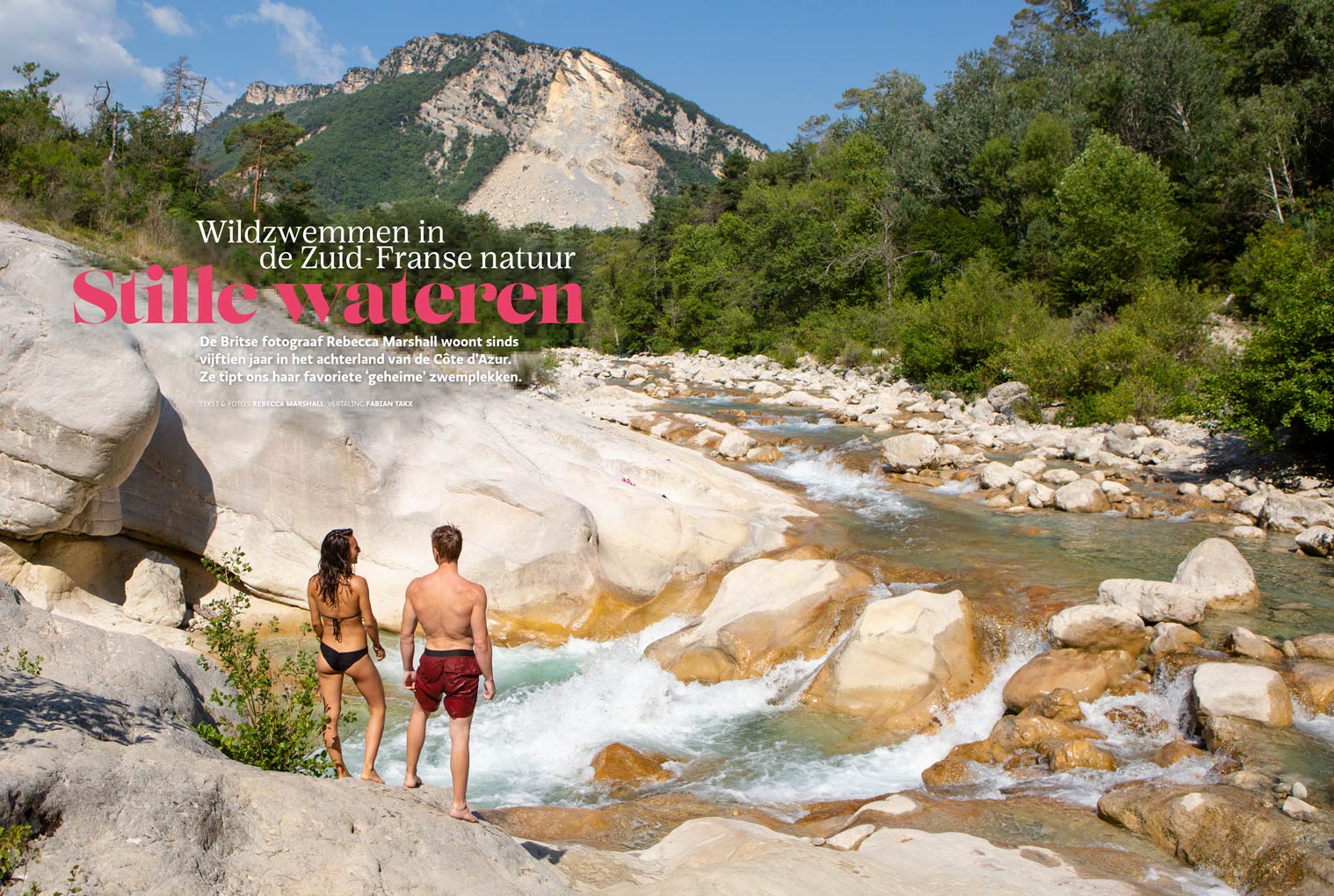 Double page magazine spread showing a full bleed photograph of a couple standing by rapids in a mountain landscape