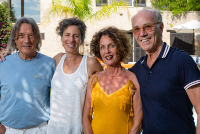 Photograph of two men and two women smiling at the camera