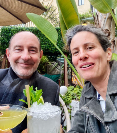 Selfie of Rebecca Marshall and Pierre de Gaulle in a garden bar with drinks