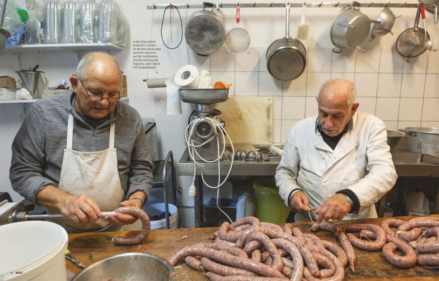Double-page spread inside BEEF! magazine, showing a full-bleed photo of sausage makers