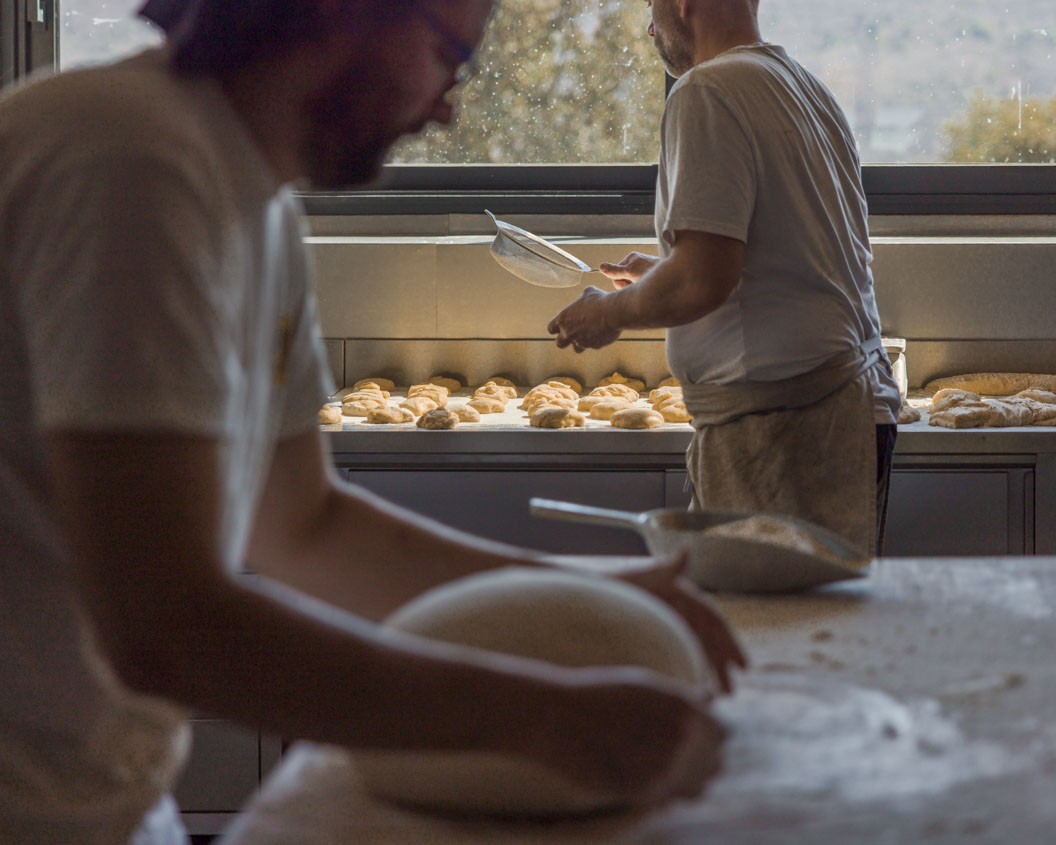 Photograph of two bakers at work in their bakery