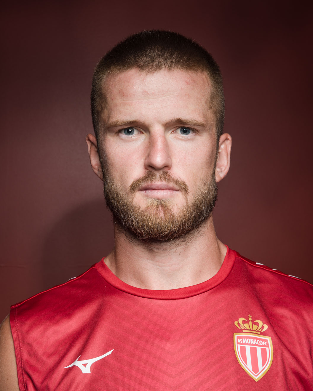 Photographic portrait of footballer Eric Dier wearing a red AS Monaco shirt