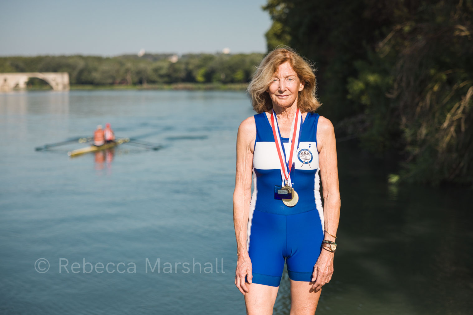 Pauline Fry Portrait of 80-year-old rower Pauline Fry with her oars, the Pont d'Avignon in the background